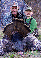 A proud young hunter with a beautiful turkey taken during Vermont's turkey hunting season